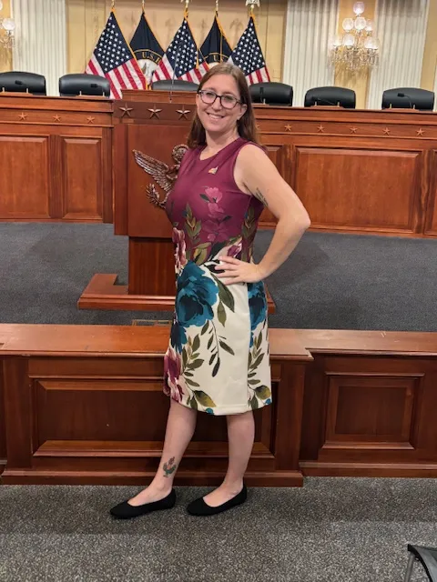 Diana Gelfand smiling in a congressional hearing room on Hill Day